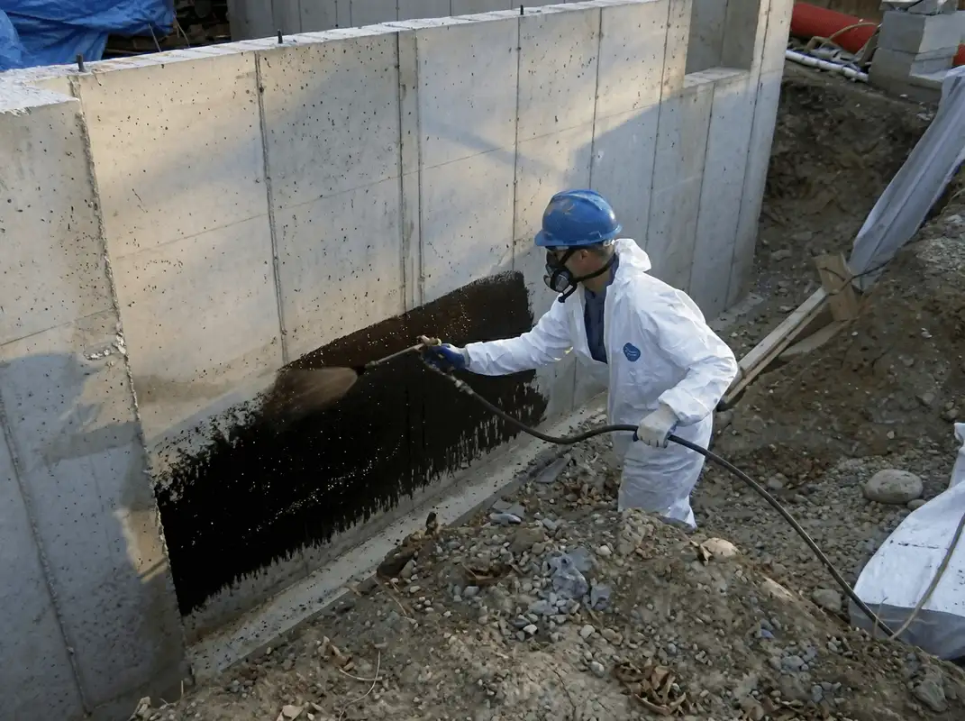 Professional waterproofing the exterior walls of the basement in Chandler, AZ